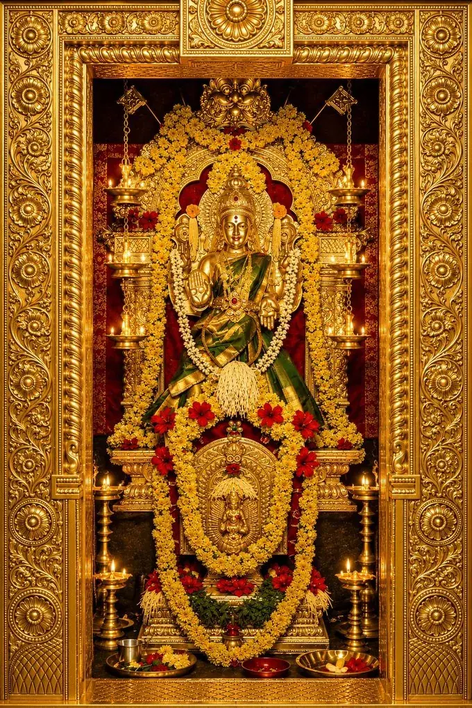 Sri Kula Mahastri Amma of Barkur — the family Kuladevi, a form of Goddess Mahalakshmi, enshrined in gold and adorned with garlands and lit oil lamps